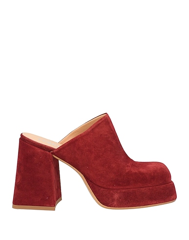 CURIOSITÉ Mules y zuecos Cuero