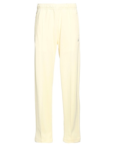 STUSSY スウェットパンツ パステルイエロー ポリエステル 56% / コットン 44%